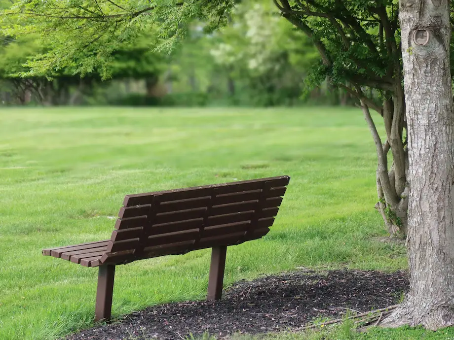 bench in well manicured cemetery