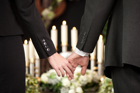 funeral holding hands